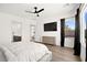 Spacious bedroom featuring modern furnishings, wood floors, natural light, and a luxurious feel at 9815 Evergreen Pine St, Las Vegas, NV 89166