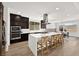 Contemporary kitchen with a large center island, stainless steel appliances, and sleek finishes at 9815 Evergreen Pine St, Las Vegas, NV 89166