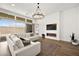Bright living room featuring a modern fireplace, TV, and sliding glass doors to the outside at 9815 Evergreen Pine St, Las Vegas, NV 89166
