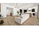 Spacious living room featuring a light wood floor and opening to the kitchen at 9815 Evergreen Pine St, Las Vegas, NV 89166
