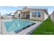 Backyard featuring a sparkling pool, lounge chairs, and a modern home exterior perfect for outdoor enjoyment at 9815 Evergreen Pine St, Las Vegas, NV 89166