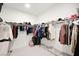 Spacious walk-in closet with extensive shelving and hanging space for clothing and accessories at 9815 Evergreen Pine St, Las Vegas, NV 89166
