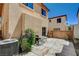 Private backyard patio area, ideal for outdoor dining and gatherings, accessible through sliding glass doors at 1007 Shades End Ave, North Las Vegas, NV 89081