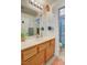 Bright bathroom featuring a single sink vanity with a neutral countertop and ample storage at 1007 Shades End Ave, North Las Vegas, NV 89081