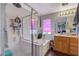 Bathroom featuring a soaking tub, shower, and vanity with modern fixtures at 1007 Shades End Ave, North Las Vegas, NV 89081