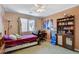 Comfortable bedroom features a ceiling fan, a window providing natural light, and ample space at 1007 Shades End Ave, North Las Vegas, NV 89081