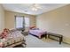 Bedroom featuring two twin beds, a ceiling fan, and neutral paint at 1007 Shades End Ave, North Las Vegas, NV 89081