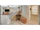 Home entryway with tile flooring, staircase, and neutral color palette at 1007 Shades End Ave, North Las Vegas, NV 89081
