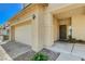 Charming home exterior featuring a two-car garage and covered entryway at 1007 Shades End Ave, North Las Vegas, NV 89081