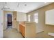 A well-lit hallway features a built-in cabinet and access to other rooms in the house at 1007 Shades End Ave, North Las Vegas, NV 89081