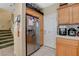 Kitchen area featuring stainless steel refrigerator and wood cabinets at 1007 Shades End Ave, North Las Vegas, NV 89081
