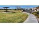 Community park with a gazebo, walking path, grassy area, and beautiful trees for Gathering picnics and relaxing at 1007 Shades End Ave, North Las Vegas, NV 89081