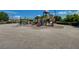 Community playground featuring modern play structures for children, surrounded by open space at 1007 Shades End Ave, North Las Vegas, NV 89081