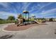 Community playground with multiple play structures and open space for recreational activities at 1007 Shades End Ave, North Las Vegas, NV 89081