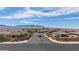 Stunning aerial view of a desert community, showcasing beautiful landscaping and mountain vistas at 1047 Atkins Ln, Mesquite, NV 89027