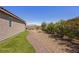 Fully landscaped backyard with artificial turf and desert landscaping at 1047 Atkins Ln, Mesquite, NV 89027