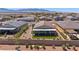 Aerial view of a landscaped backyard featuring a covered patio and well-manicured lawn at 1047 Atkins Ln, Mesquite, NV 89027