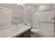 Bathroom features a glass enclosed shower, modern sink, and gray cabinets at 1047 Atkins Ln, Mesquite, NV 89027