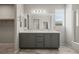 Bathroom with a double sink vanity and large mirror at 1047 Atkins Ln, Mesquite, NV 89027