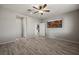 Bright bedroom with wood-look floors, ceiling fan and a media center at 1047 Atkins Ln, Mesquite, NV 89027