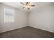 Bedroom with neutral carpet, ceiling fan, and a bright window at 1047 Atkins Ln, Mesquite, NV 89027