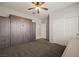 Bedroom view with neutral carpet, featuring a large built-in wall unit and closet at 1047 Atkins Ln, Mesquite, NV 89027