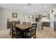 Dining room and kitchen feature wood-look tile floors, stainless appliances and recessed lights at 1047 Atkins Ln, Mesquite, NV 89027
