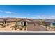 Attractive single story home featuring low-maintenance desert landscaping and a brick paved driveway at 1047 Atkins Ln, Mesquite, NV 89027