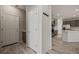 Hallway with white doors and stylish light wood-look vinyl flooring at 1047 Atkins Ln, Mesquite, NV 89027