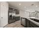 Updated kitchen featuring stainless steel refrigerator, island, and recessed lighting at 1047 Atkins Ln, Mesquite, NV 89027