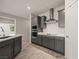 Chic kitchen showcasing gray cabinetry, stainless appliances, and modern design at 1047 Atkins Ln, Mesquite, NV 89027