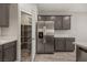 Well-organized pantry and stainless steel refrigerator in modern kitchen at 1047 Atkins Ln, Mesquite, NV 89027