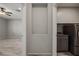 Modern laundry room featuring gray cabinetry and stainless steel washer and dryer at 1047 Atkins Ln, Mesquite, NV 89027