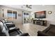 Comfortable living room with slider access to the patio, ceiling fan and natural light at 1047 Atkins Ln, Mesquite, NV 89027