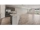 Open-concept kitchen and living area, featuring an island and access to backyard at 1047 Atkins Ln, Mesquite, NV 89027