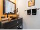Bathroom with a vanity, black hardware, vessel sink, and decorative towels at 10579 Garden Rose Dr, Las Vegas, NV 89135
