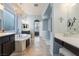 A luxurious bathroom with a soaking tub, makeup vanity and neutral paint at 10579 Garden Rose Dr, Las Vegas, NV 89135
