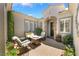 Cozy courtyard featuring comfortable seating, a charming fireplace, and tasteful landscaping at 10579 Garden Rose Dr, Las Vegas, NV 89135
