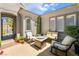 Inviting courtyard area featuring comfortable seating, a table with fire pit, and privacy landscaping at 10579 Garden Rose Dr, Las Vegas, NV 89135