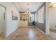 Dining room with tiled floors, a decorative chandelier, and natural light from shuttered window at 10579 Garden Rose Dr, Las Vegas, NV 89135