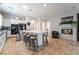 Kitchen features a large center island with seating, fireplace, and tile flooring at 10579 Garden Rose Dr, Las Vegas, NV 89135