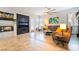 Open-concept living room with fireplace, shutters, ceiling fan and lots of natural light at 10579 Garden Rose Dr, Las Vegas, NV 89135