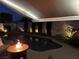 Evening ambiance highlights the pool, landscape lighting, comfortable seating area, and stylish patio at 10579 Garden Rose Dr, Las Vegas, NV 89135