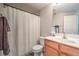 Functional bathroom featuring a single sink vanity, toilet, and shower with a curtain at 10636 Colter Bay Ct, Las Vegas, NV 89129