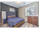 Cozy bedroom featuring modern decor, a comfortable bed, and natural light from the window at 10636 Colter Bay Ct, Las Vegas, NV 89129