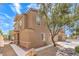 Exterior view of a two-story home, showcasing desert landscaping and a neighborhood street at 10636 Colter Bay Ct, Las Vegas, NV 89129
