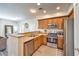 Functional kitchen featuring wood cabinets, stainless steel appliances, and an open layout at 10636 Colter Bay Ct, Las Vegas, NV 89129