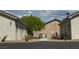 Exterior shot showcasing the property's facade, landscaping, and access to walkways at 1111 Sixshooter Ave, Pahrump, NV 89048