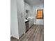 Kitchen features modern stainless steel appliances and elegant white cabinetry at 1111 Sixshooter Ave, Pahrump, NV 89048