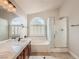 Bright bathroom featuring a shower, soaking tub, and double sink vanity at 1115 Aldenwood Ave, Las Vegas, NV 89123